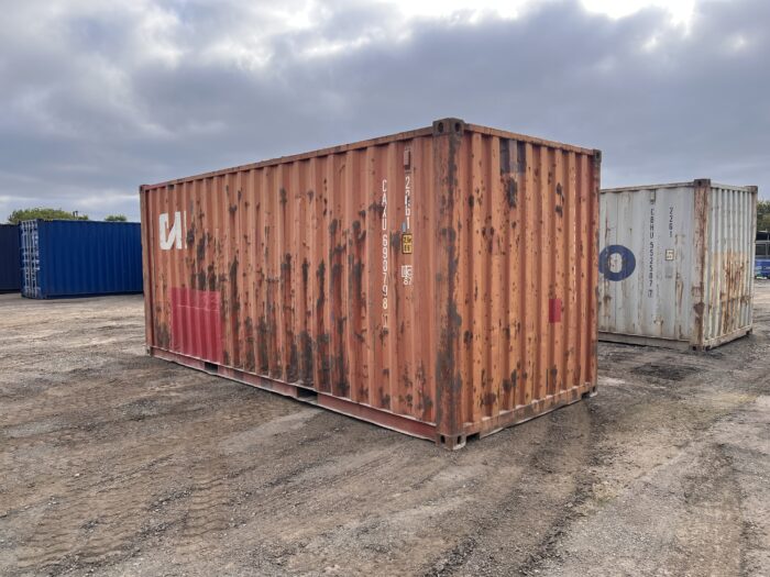 Right-hand side of a weathered CAI 20ft used container with WWT status