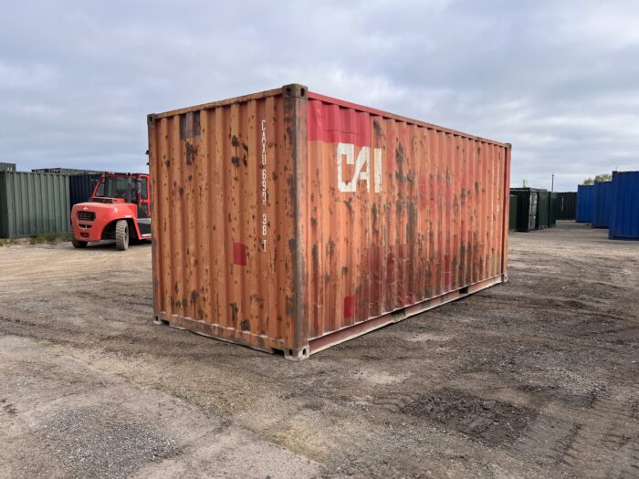 Rear corner and left-hand side of a used 20ft shipping container marked CAI